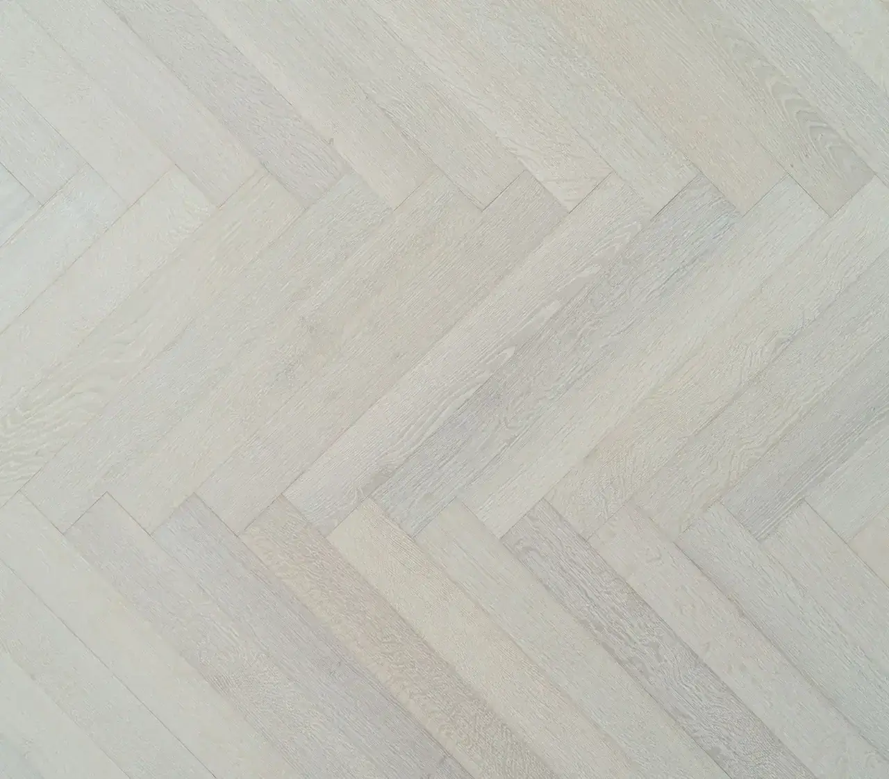 Bergamo Floors Herringbone & Chevron Oak Tramonto Herringbone European White Oak Engineered Hardwood, installed in a room