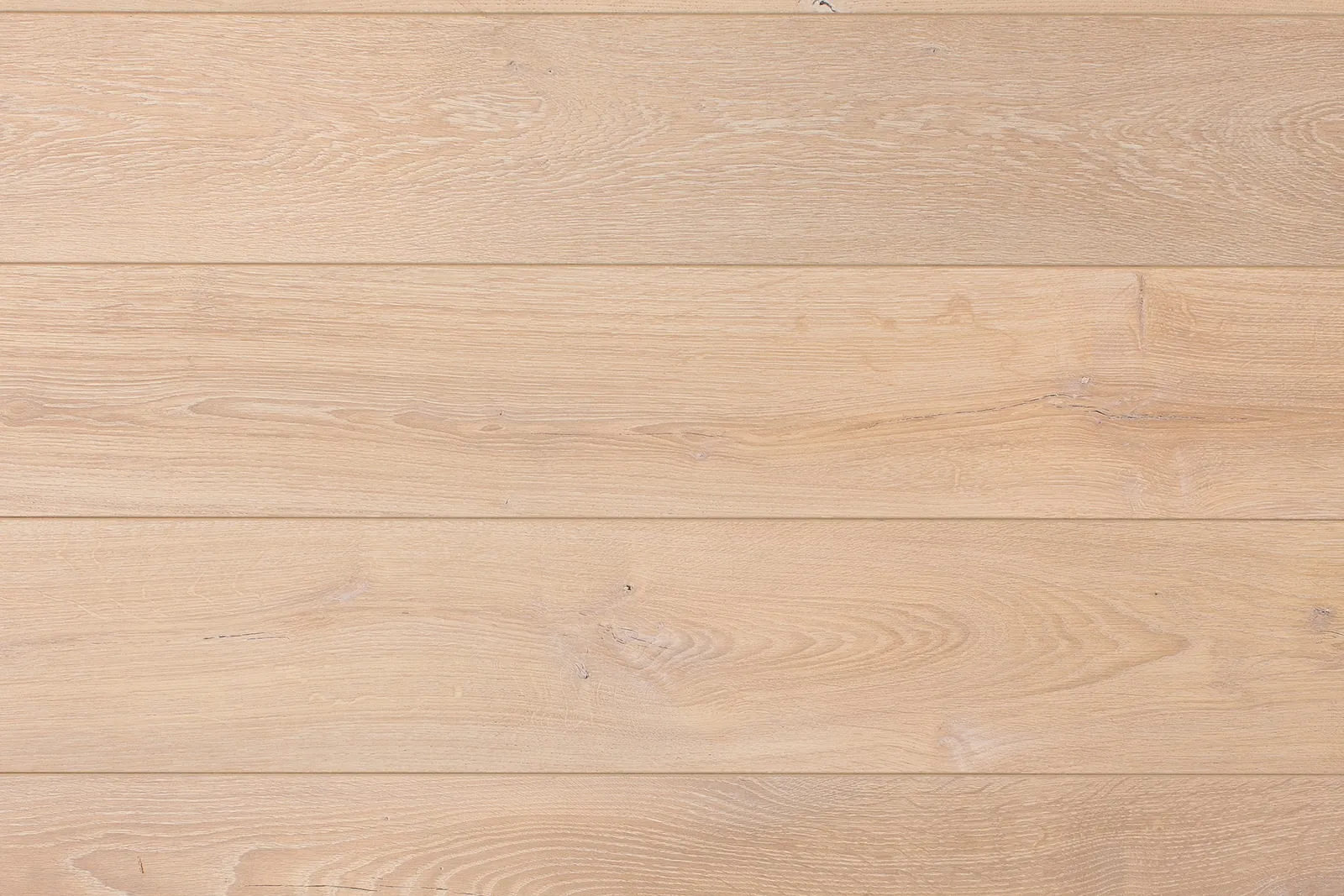 Light oak laminate flooring planks compared with luxury vinyl plank